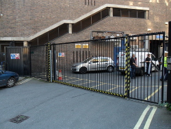 A anti climb steel gate topped with 'sharks teeth' spikes.